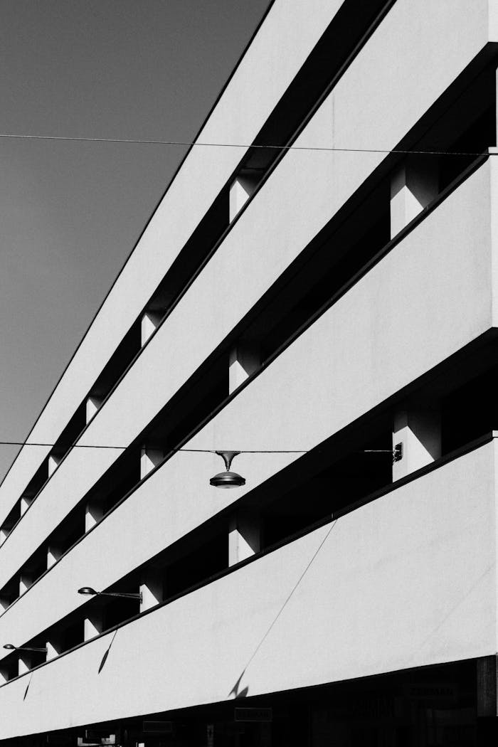 Black and white photo showcasing minimalist architecture with clean lines and sharp angles in Almere.